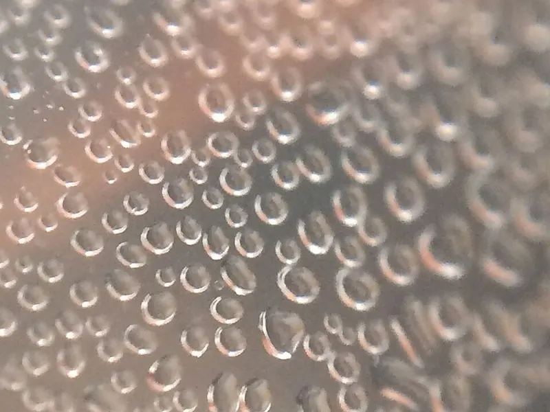 Drops of water condensed on a cold glass surface