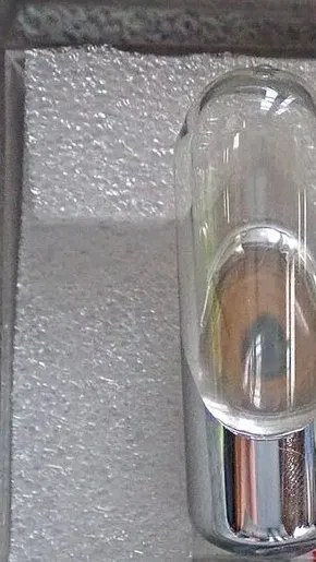 A small amount of liquid mercury inside a sealed glass tube