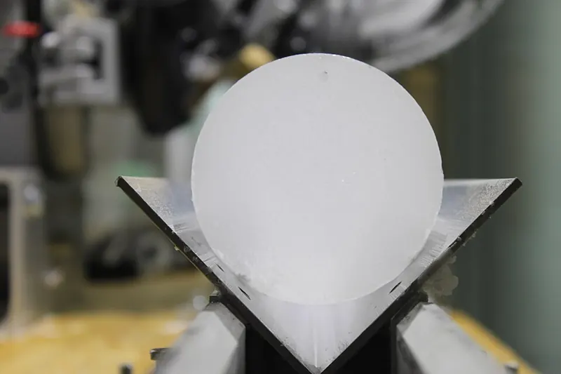 The round end of a freshly cut cylinder of ice from an ice core