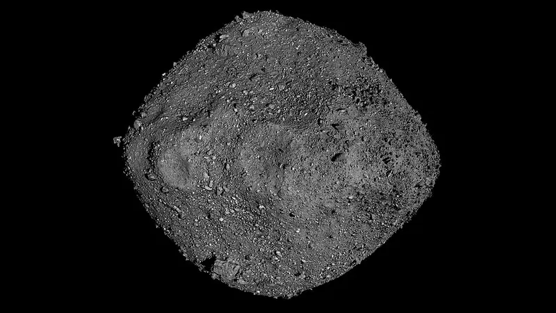 The asteroid Bennu, a dark grey rocky body covered in boulders