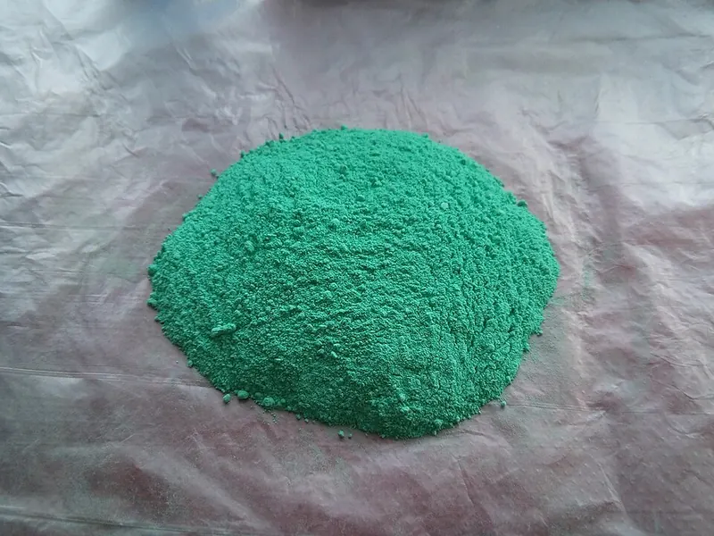 A small pile of green copper carbonate powder